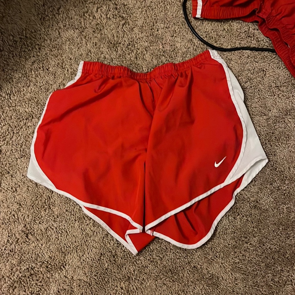 Bright red Nike athletic shorts size: child’s XL
